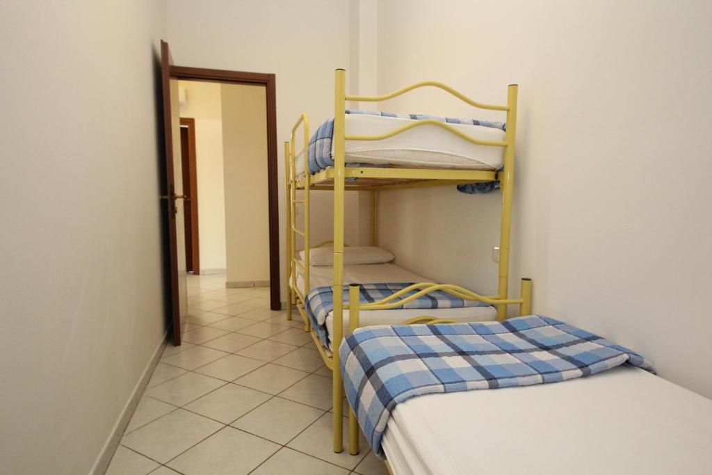 Postel nebo postele na pokoji v ubytování Acquasmeralda appartamento 03