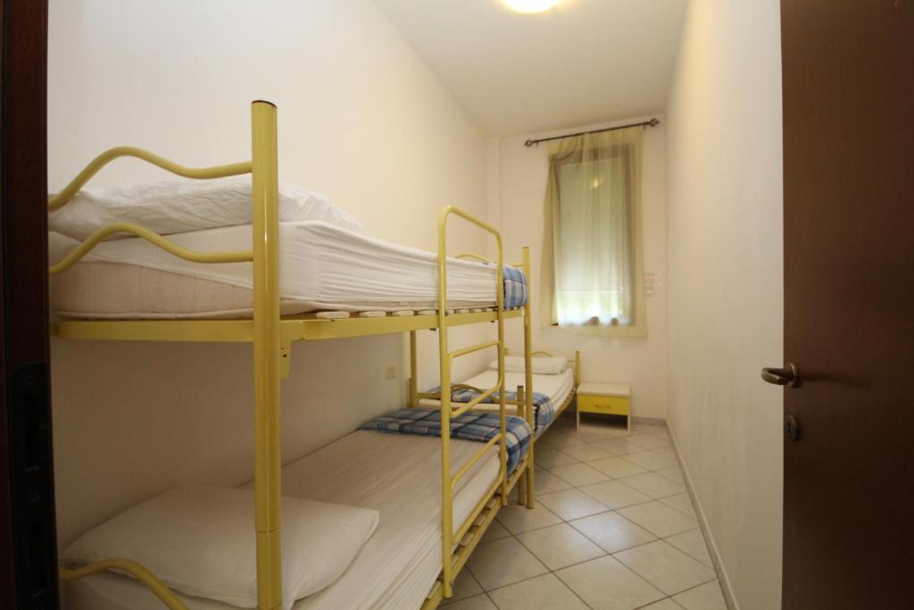 Postel nebo postele na pokoji v ubytování Acquasmeralda appartamento 03