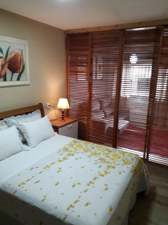 En eller flere senge i et værelse på Espaço Kayan