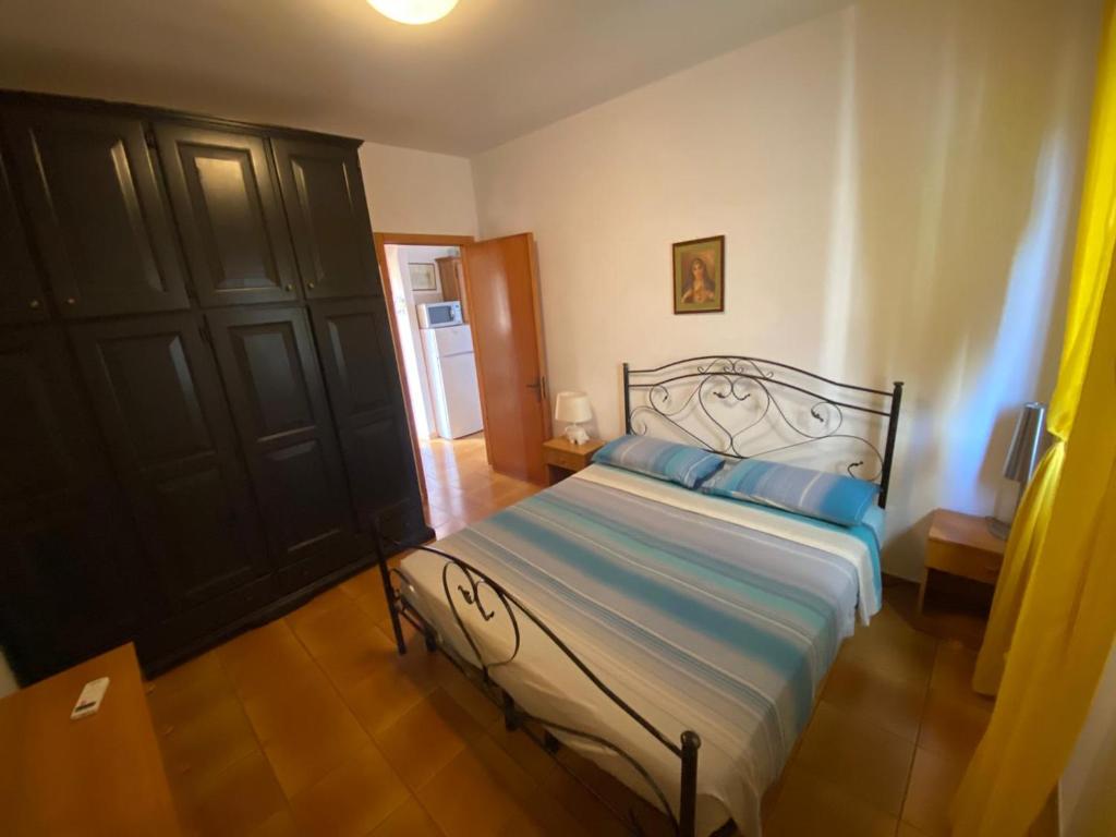 A bed or beds in a room at La casa di mare Salento