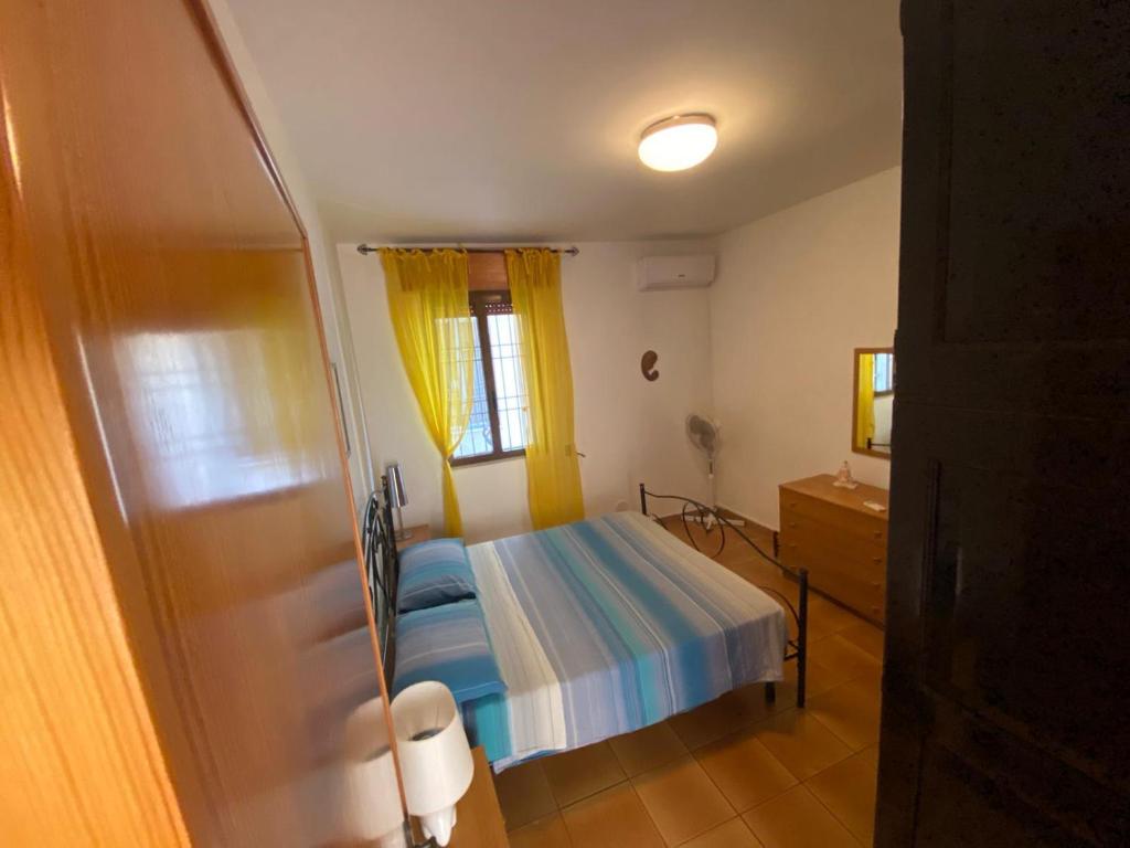 A bed or beds in a room at La casa di mare Salento