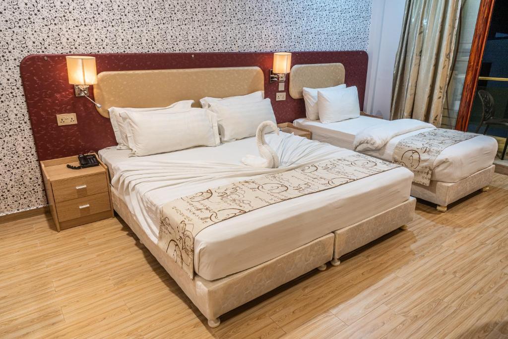 Postel nebo postele na pokoji v ubytování Sunrise Beach