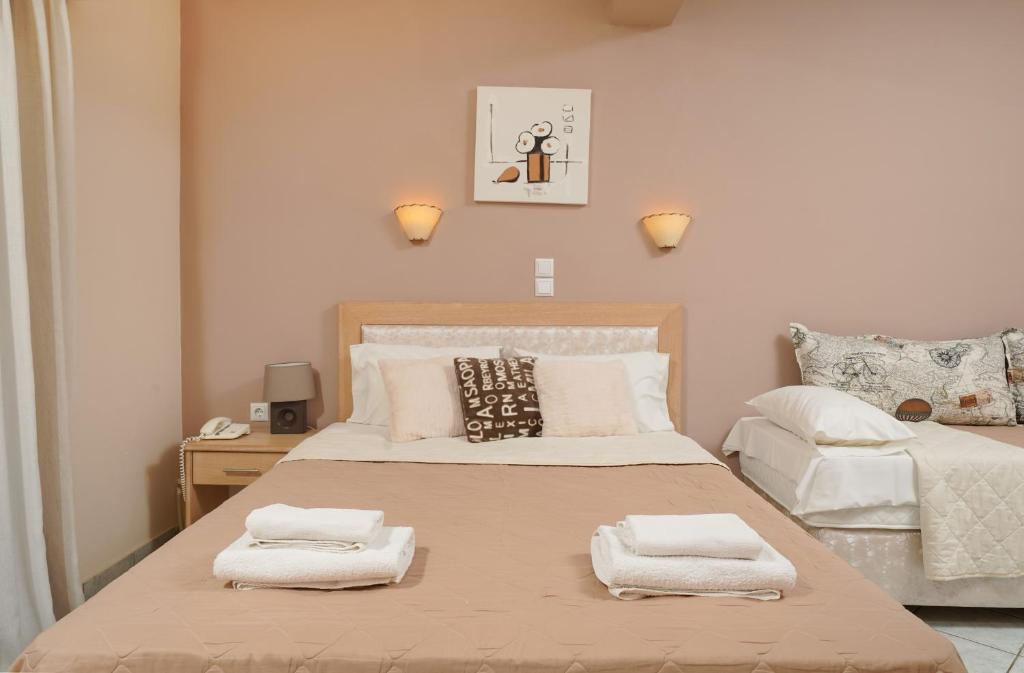 Postel nebo postele na pokoji v ubytování Hotel Makrina