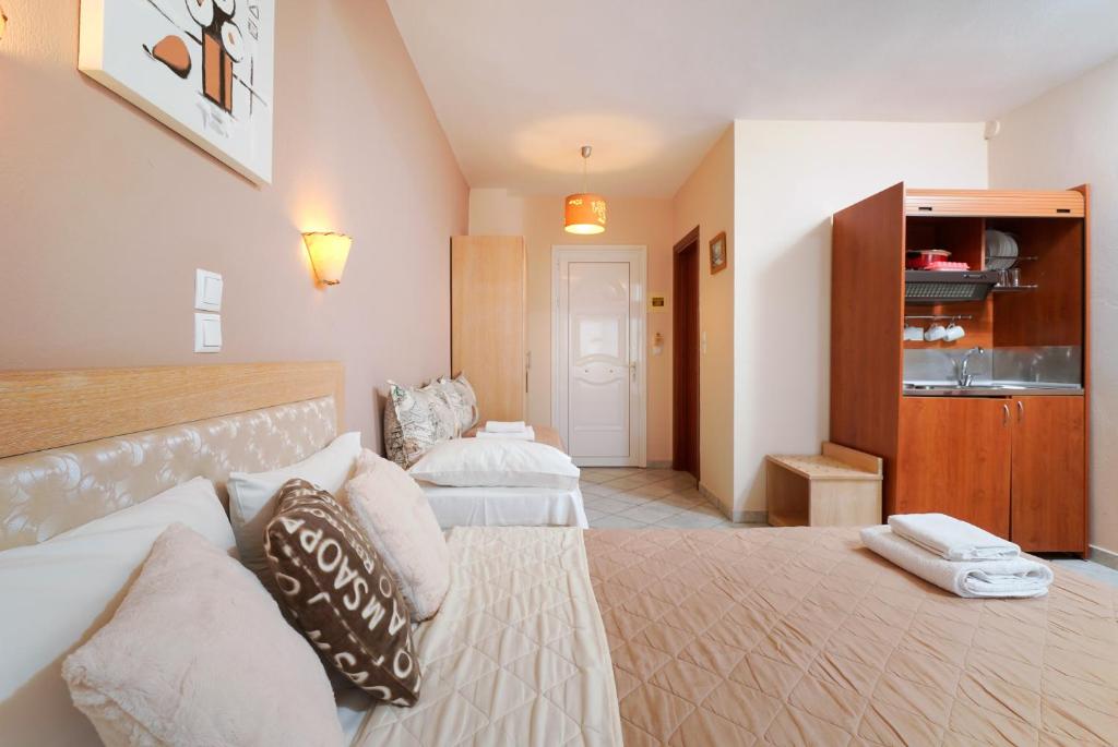 Postel nebo postele na pokoji v ubytování Hotel Makrina