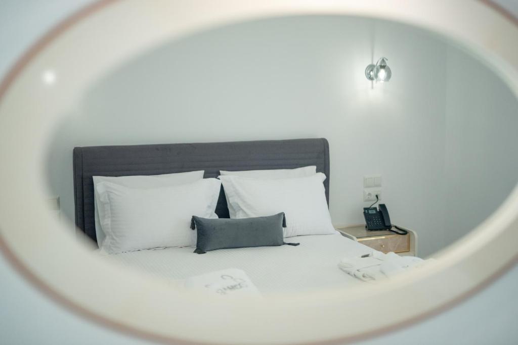 Postel nebo postele na pokoji v ubytování Sueño Suites