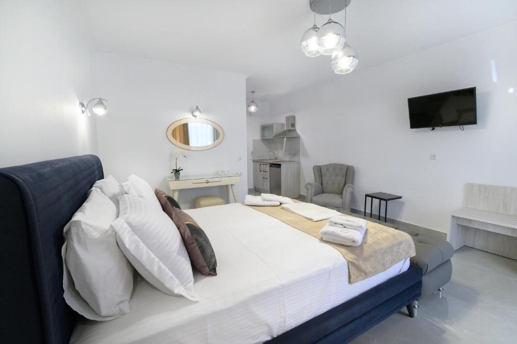 Postel nebo postele na pokoji v ubytování Sueño Suites