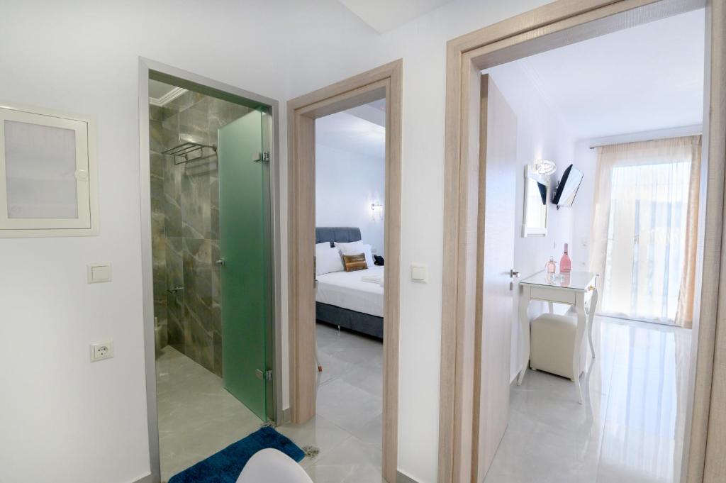 Postel nebo postele na pokoji v ubytování Sueño Suites