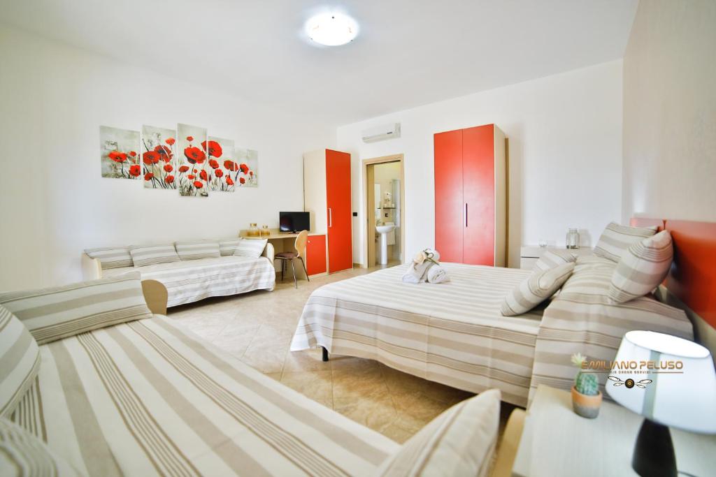 Postel nebo postele na pokoji v ubytování B&B La Casa di Attilio