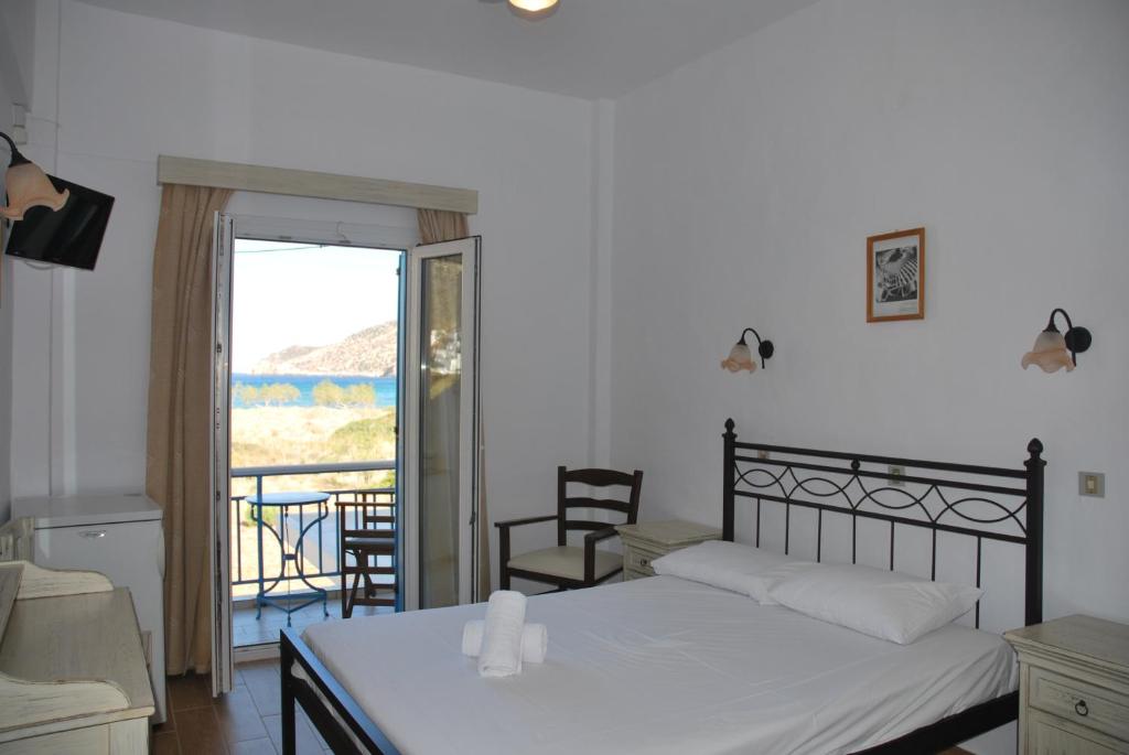 Кровать или кровати в номере Afroditi Hotel