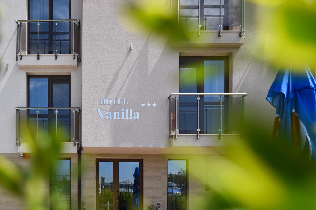 a building with a sign on the side of it at Hotel Vanilla, Varna - Free parking in Varna City