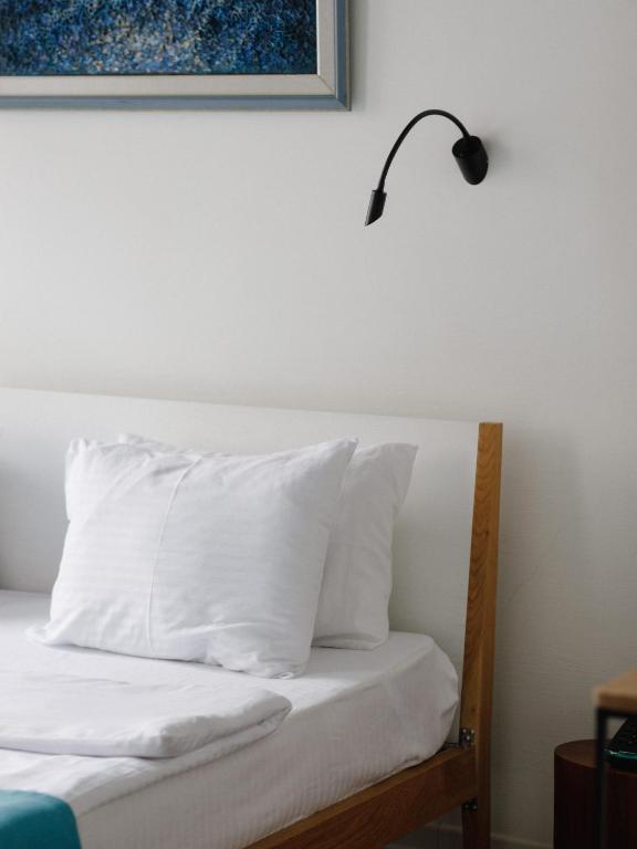 Postel nebo postele na pokoji v ubytování Mariinsky Boutique Hotel