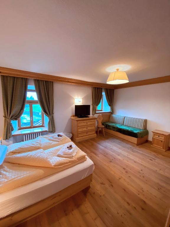 Postel nebo postele na pokoji v ubytování Rifugio Ospitale