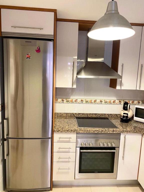 Kuchyň nebo kuchyňský kout v ubytování Flamingo Apartment Coto Real La Duquesa