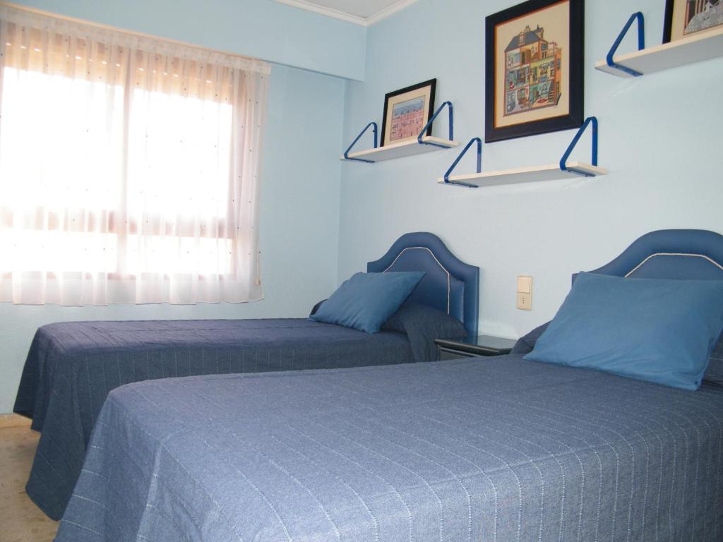 Postel nebo postele na pokoji v ubytování APARTAMENTO SALINAS IV 9º, Mnostrum Playa de Gandía EXCLUSIVO FAMILIAS