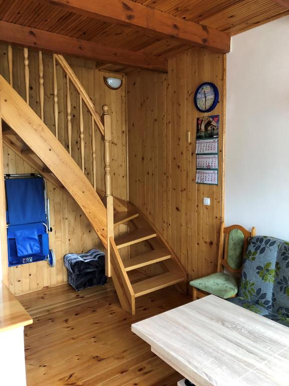 Postel nebo postele na pokoji v ubytování Apartamenty pod dębem
