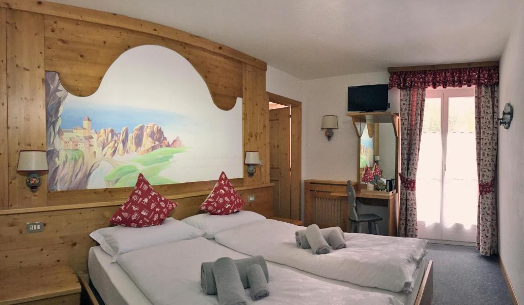 Postel nebo postele na pokoji v ubytování Rifugio Monti Pallidi