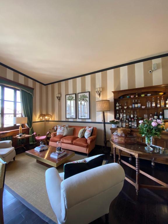 a living room with a couch and a table at Hotel Hermitage in Florence