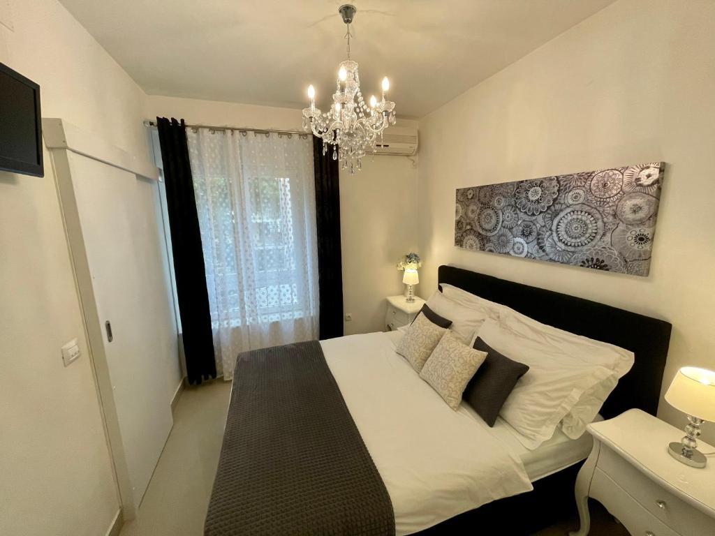Postel nebo postele na pokoji v ubytování Central Square Guest House