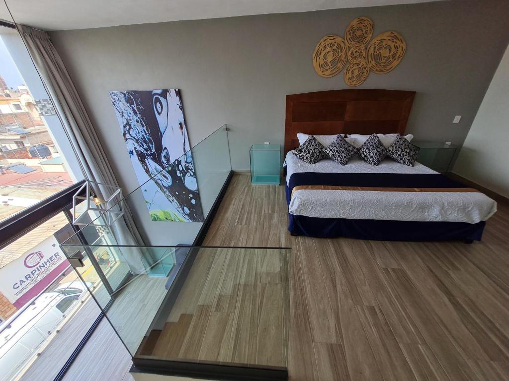 Postel nebo postele na pokoji v ubytování Casa Arandas Hotel - Suits