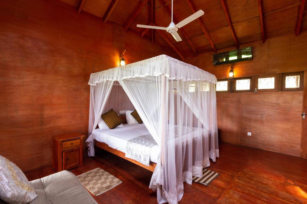 Postel nebo postele na pokoji v ubytování The Hideout Sigiriya