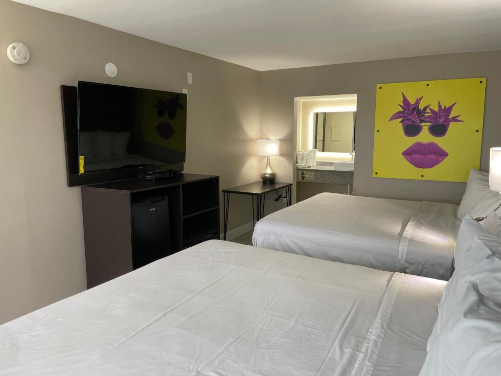 Katil atau katil-katil dalam bilik di Seaside Sands Inn