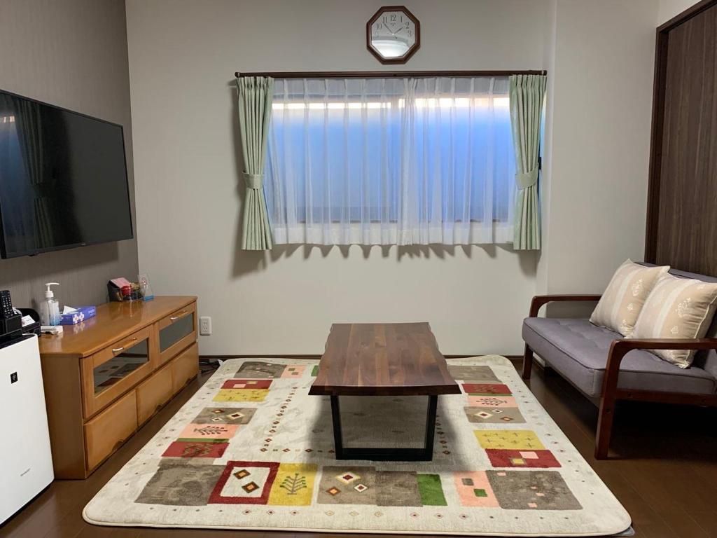 TV a/nebo společenská místnost v ubytování FunHome Nagoya Castle