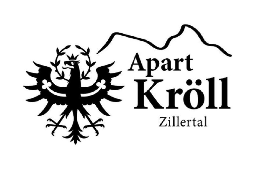 a black and white logo for an april kotil zil international at Apart Kröll in Schlitters