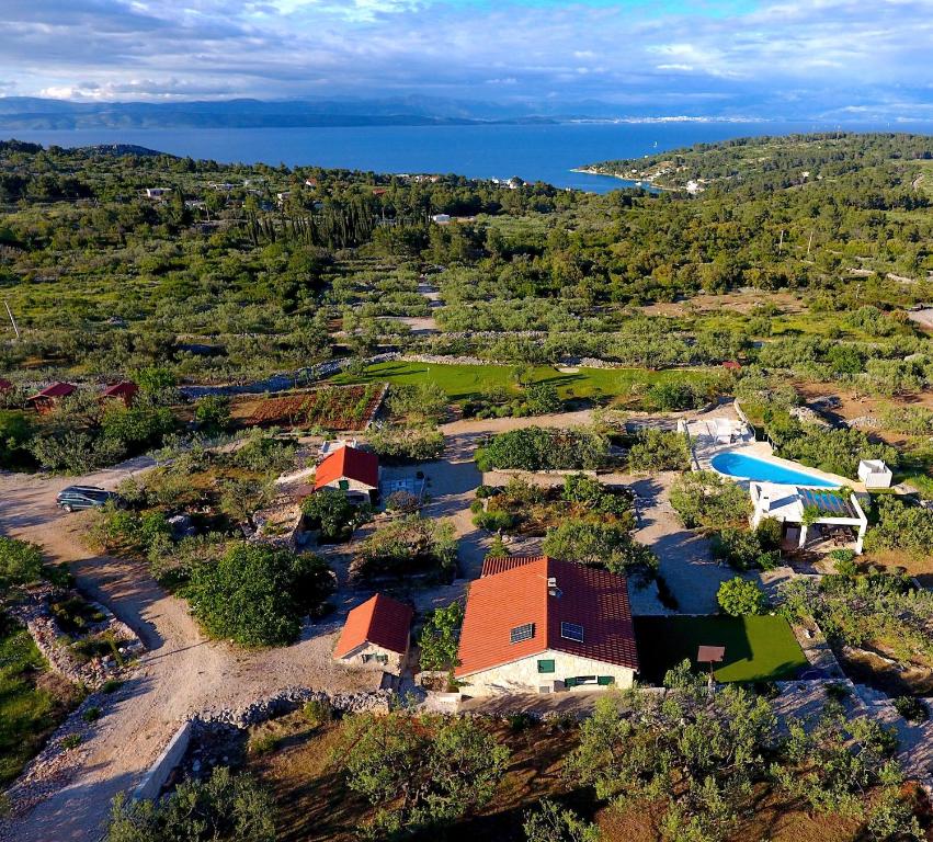 an aerial view of a house with a river at Hacienda Noa in Grohote