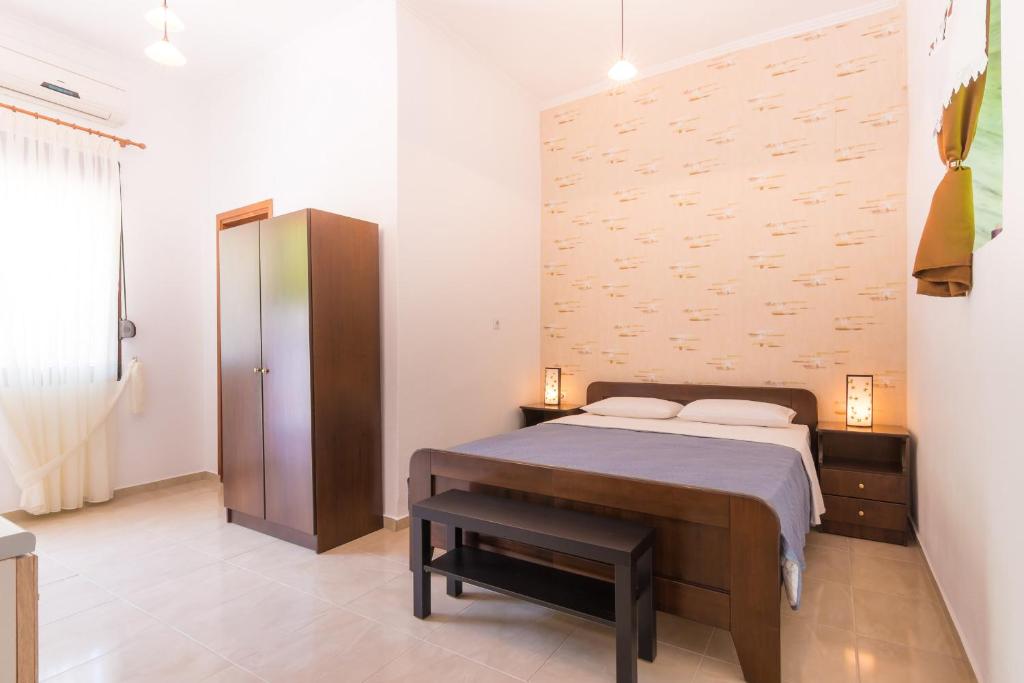 Postel nebo postele na pokoji v ubytování Lena Studios