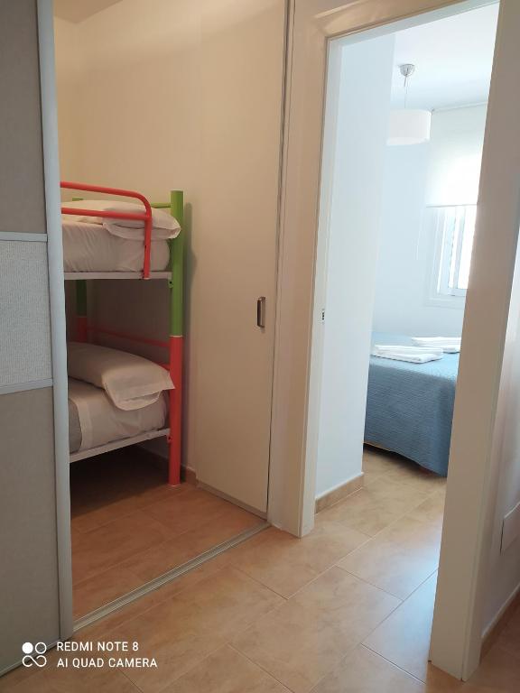 Łóżko lub łóżka w pokoju w obiekcie Apartamento playa con vistas al mar
