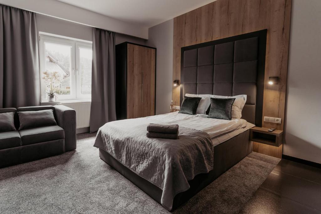 Postel nebo postele na pokoji v ubytování NOVA Apartamenty&Pokoje