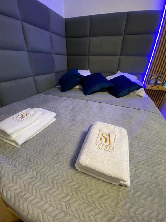 Posteľ alebo postele v izbe v ubytovaní Secret Apartments Chełmska