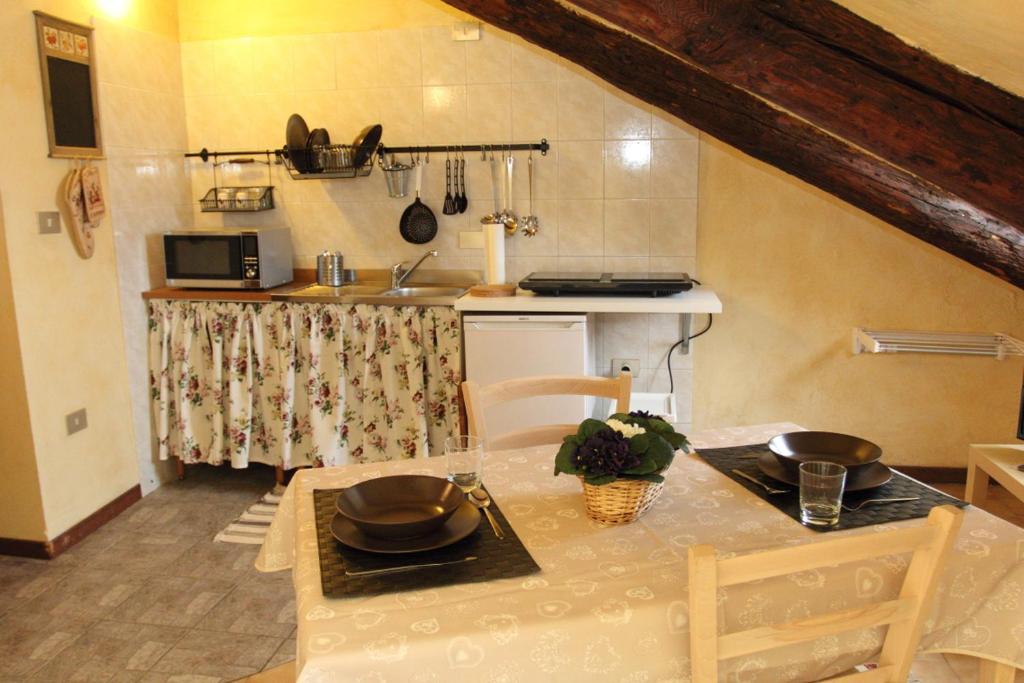 a small kitchen with a table and a counter top at Bellezia in Turin