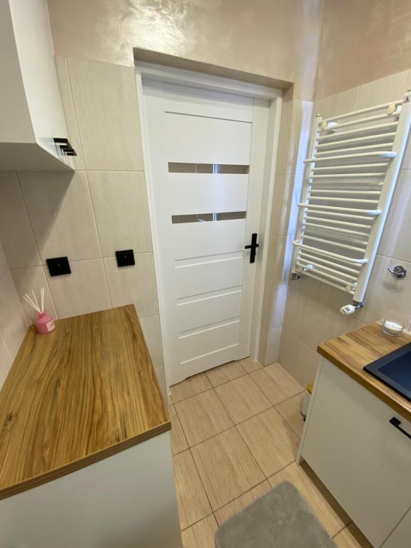Kuchyňa alebo kuchynka v ubytovaní Secret Apartments Chełmska