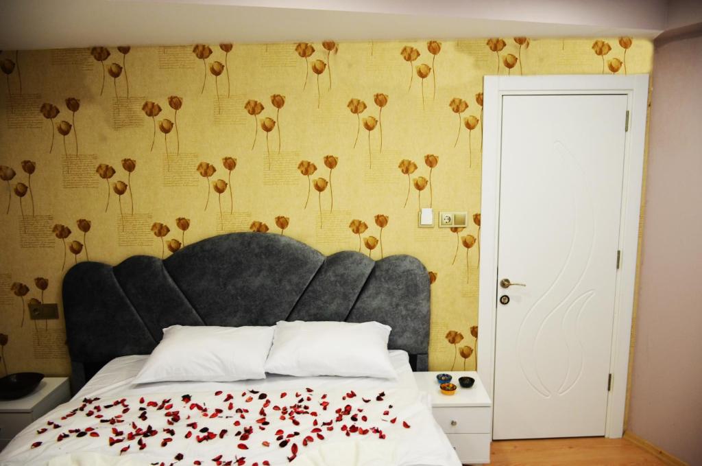 Postel nebo postele na pokoji v ubytování Rodion Hotel