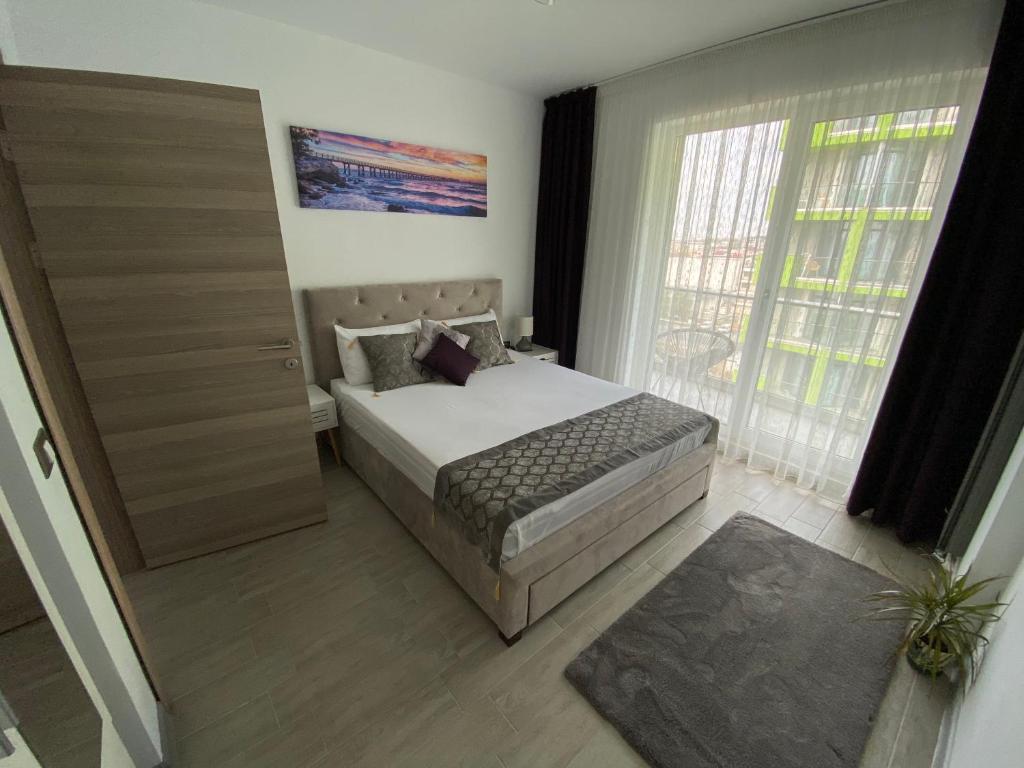 Voodi või voodid majutusasutuse MUR Apartament Alezzi Beach Resort toas