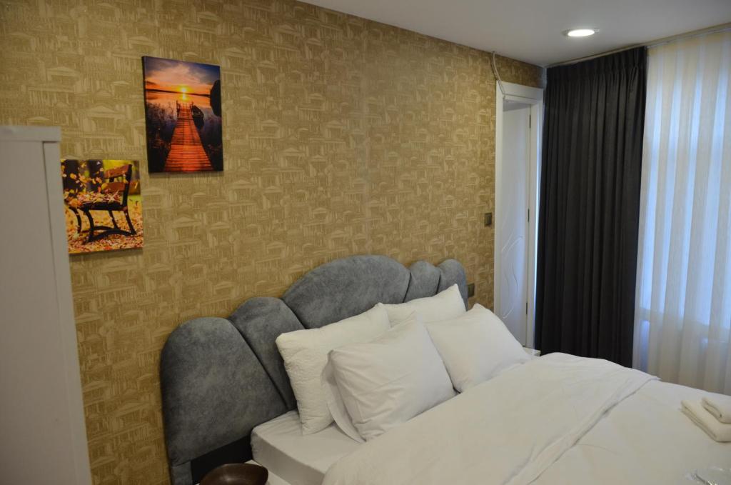 Postel nebo postele na pokoji v ubytování Rodion Hotel