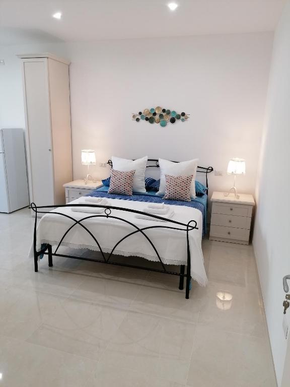 Posteľ alebo postele v izbe v ubytovaní Casa Low Cost