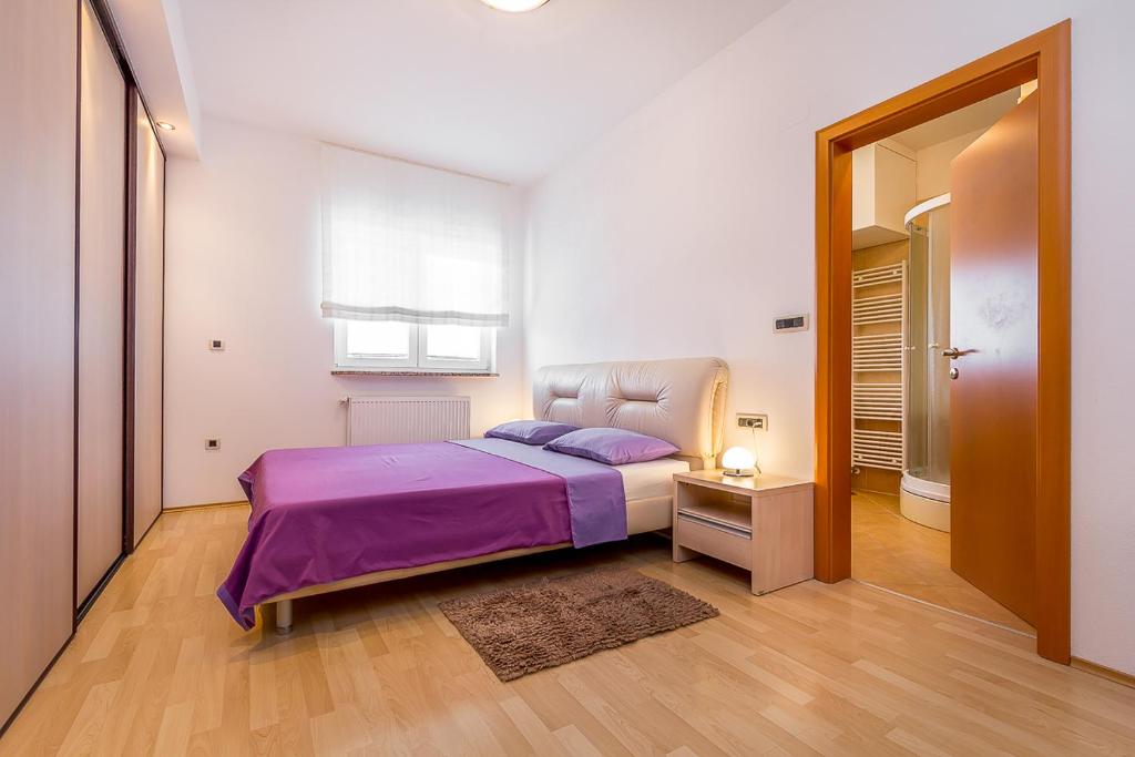 Postel nebo postele na pokoji v ubytování Apartment Igor 3 ****