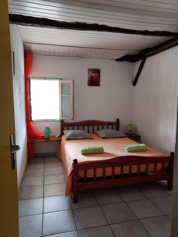 Postel nebo postele na pokoji v ubytování Gite Ti Case Lontan