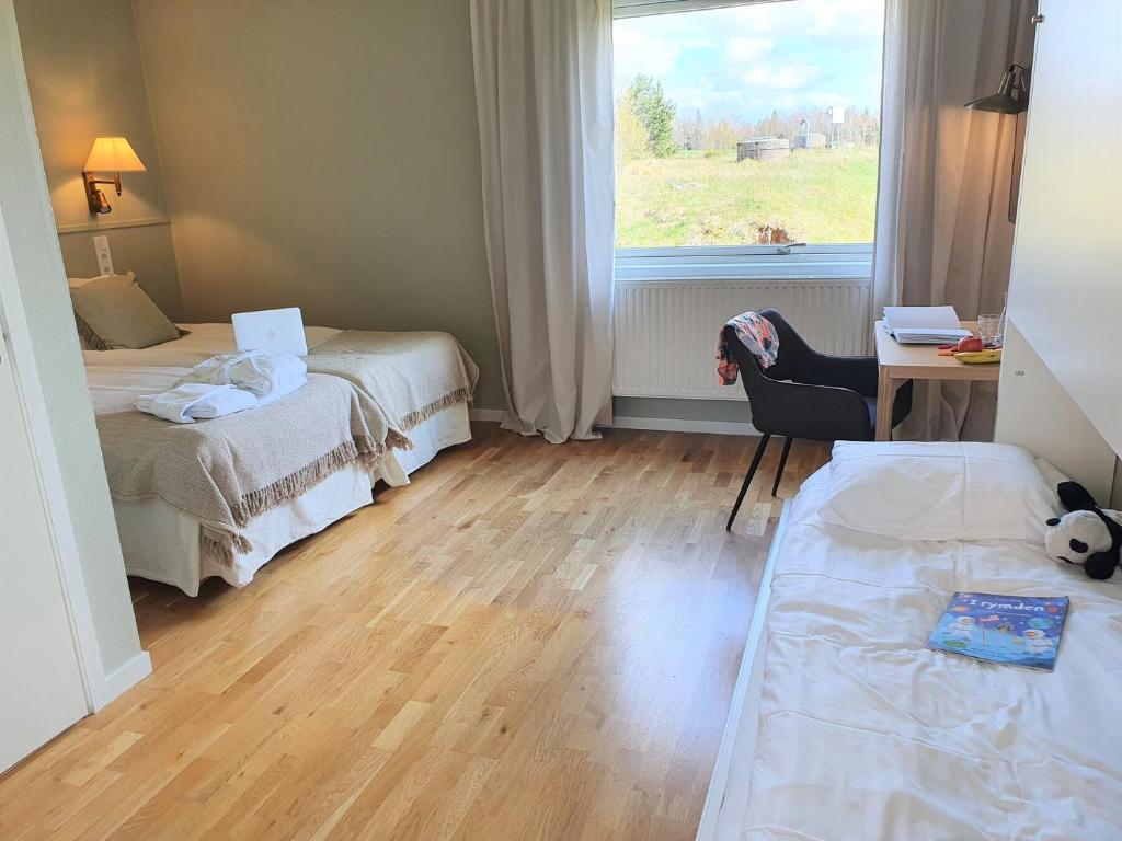 Postel nebo postele na pokoji v ubytování Bommersvik Hotell & Konferens