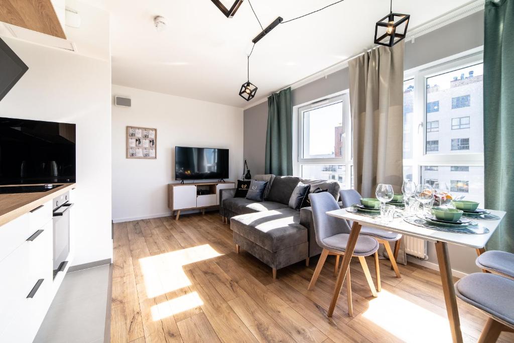 Televízia a/alebo spoločenská miestnosť v ubytovaní Apartamenty Gdansk EU - Baltica Towers 223