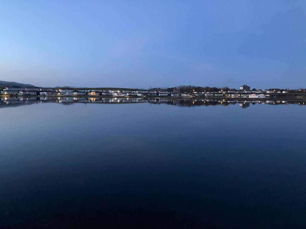 a large body of water with a city in the background at KINGDOM HOLIDAY PARK in Haverigg