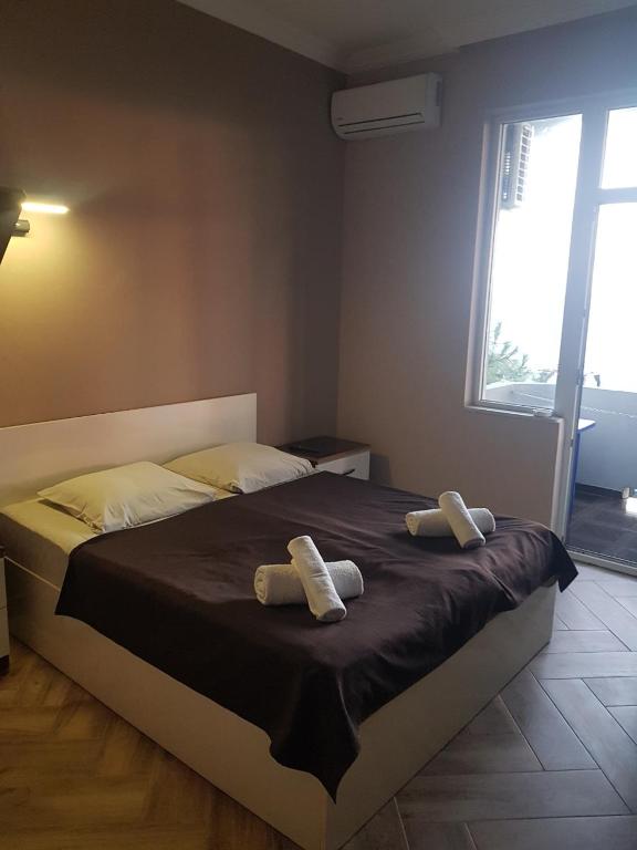 Postel nebo postele na pokoji v ubytování MIDIA Guest House