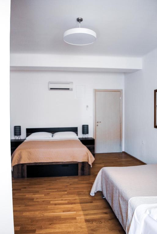 Posteľ alebo postele v izbe v ubytovaní Royal Deluxe
