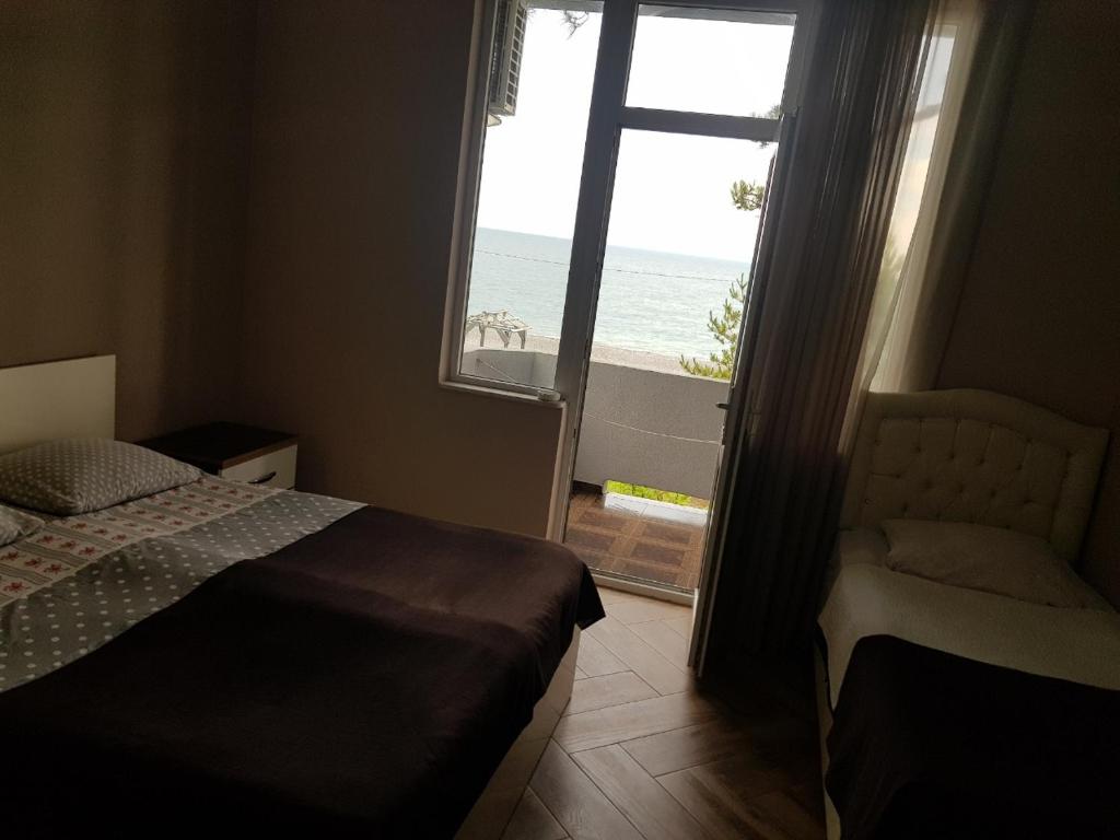 Postel nebo postele na pokoji v ubytování MIDIA Guest House