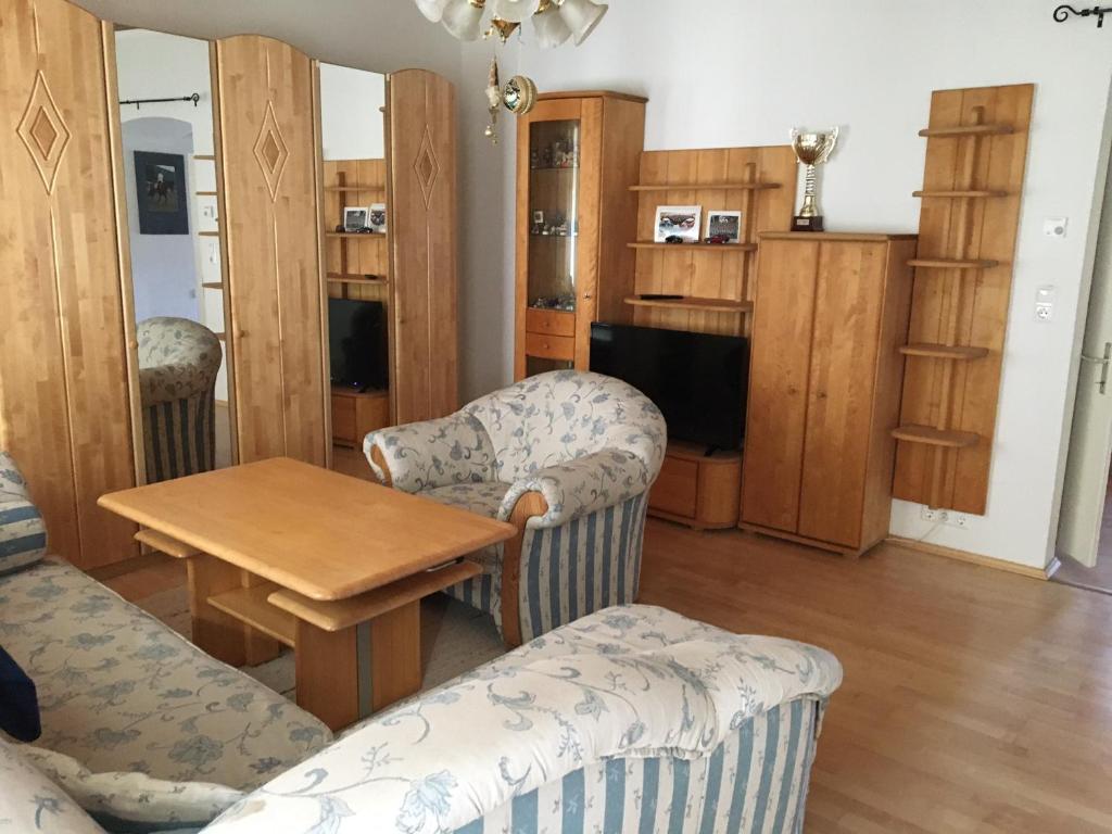 a living room with furniture and a table and chairs at Poltnigg in Arnfels