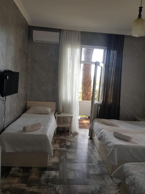 Postel nebo postele na pokoji v ubytování MIDIA Guest House