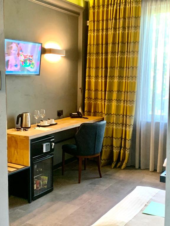 TV a/nebo společenská místnost v ubytování Plai Hotel