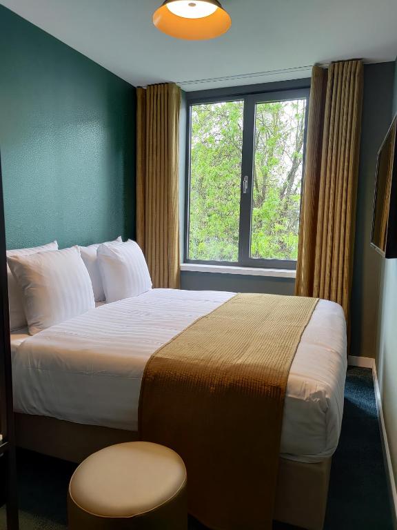 Postel nebo postele na pokoji v ubytování FD Hotels